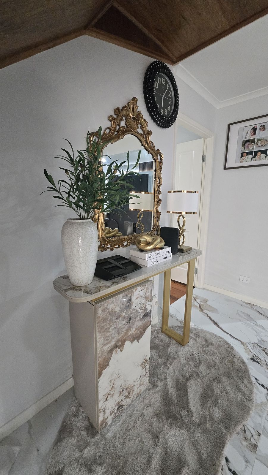 Entry console with gilded mirror and marble